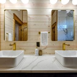 Two vessel sinks with round mirrors