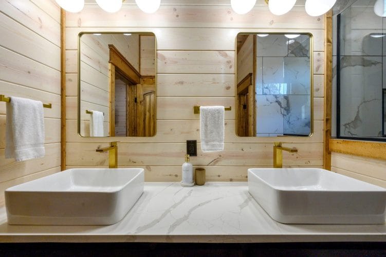 Two vessel sinks with round mirrors
