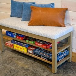 Bench with board games stored on a shelf underneath