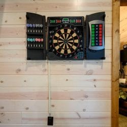 Electronic dartboard mounted on the wall