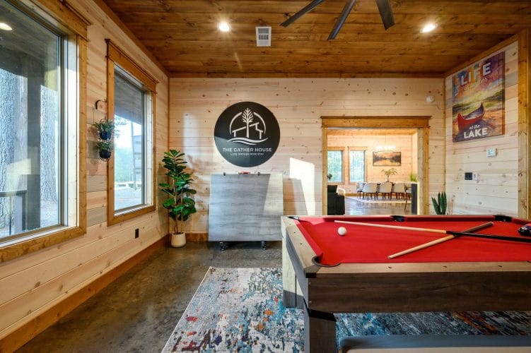 Pool table and logo sign in the game room