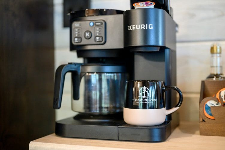 Keurig coffee maker with a mug on the coffee bar