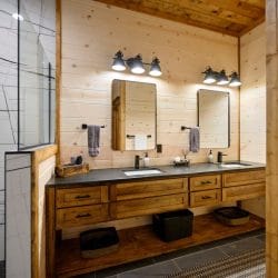 Bathroom vanity with a mirror and gray towels