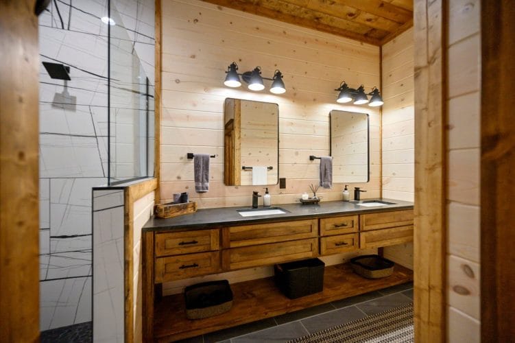 Bathroom vanity with a mirror and gray towels