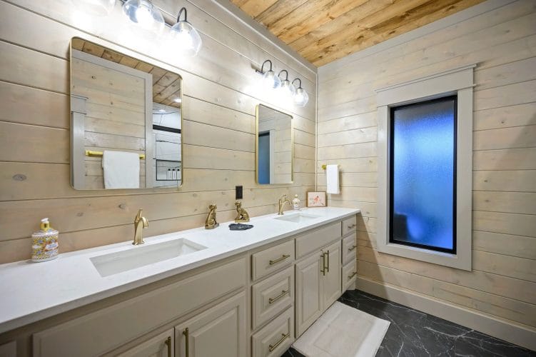 Double vanity with brass faucets