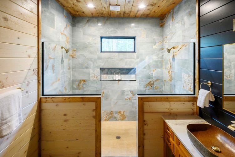 Tile shower with a window and a bowl sink