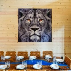 Lion portrait above the long dining table