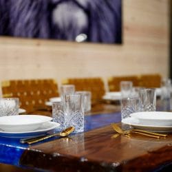 Close view of place settings on the long dining table
