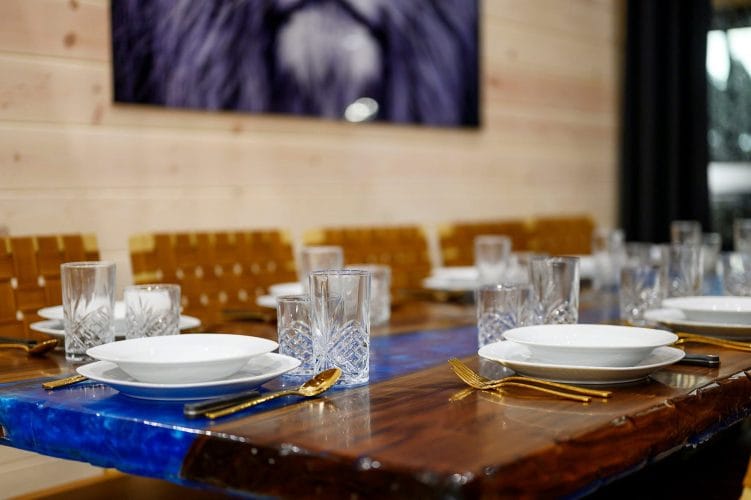Close view of place settings on the long dining table