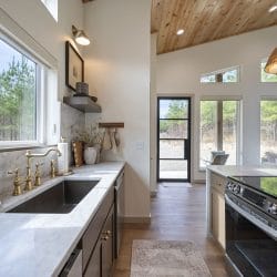 Long kitchen counter with sink and electric range