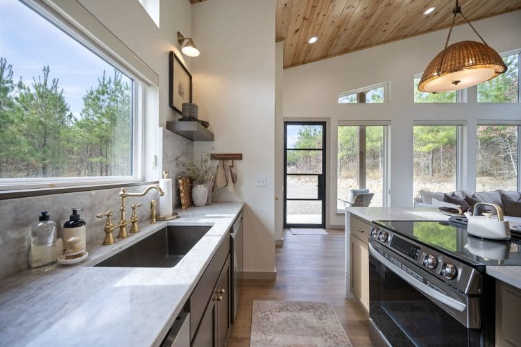 Long kitchen counter with sink and electric range