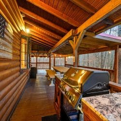 Gas grill with a granite side counter on the covered deck