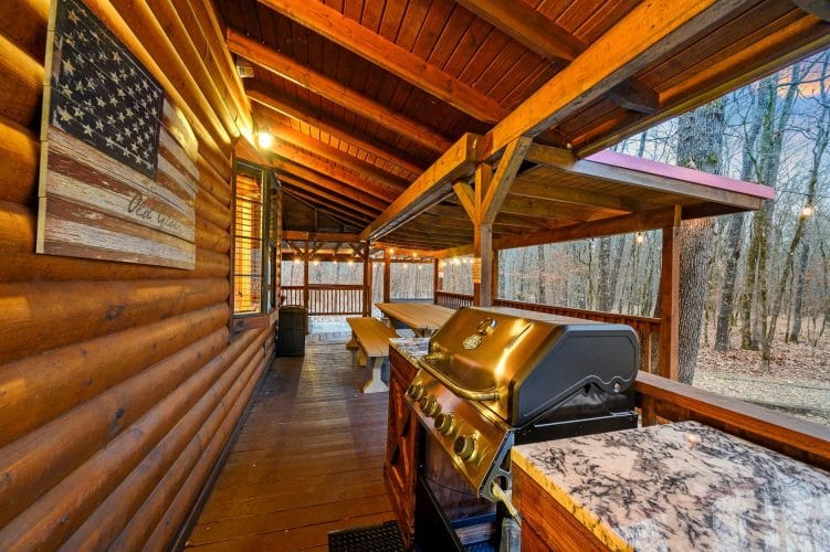 Gas grill with a granite side counter on the covered deck