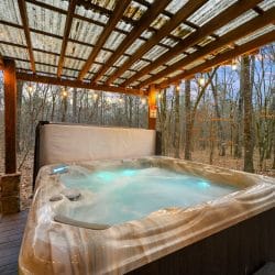 Close view of the hot tub water with the pergola above
