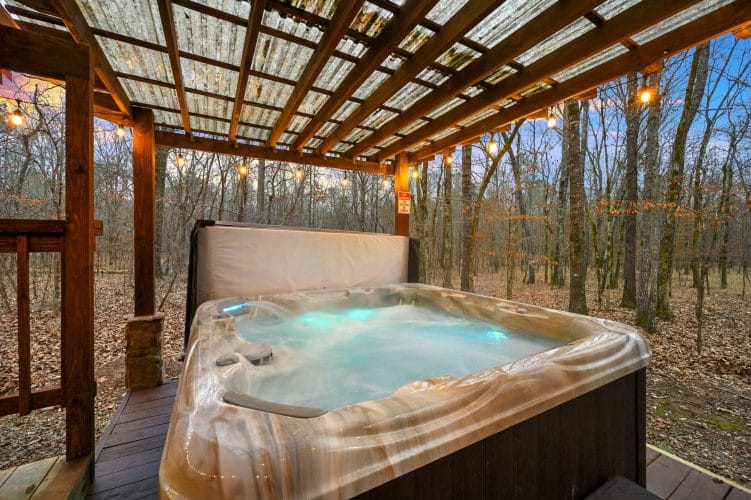 Close view of the hot tub water with the pergola above