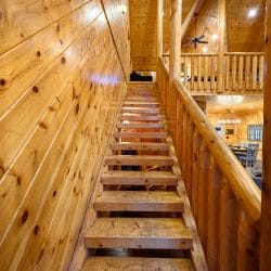 Wooden staircase leading up to the loft