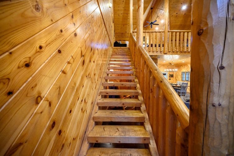 Wooden staircase leading up to the loft