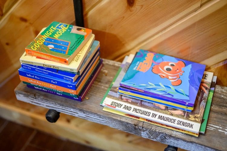 Stack of children's books on a shelf