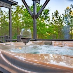 Hot tub with a glass of red wine on the edge